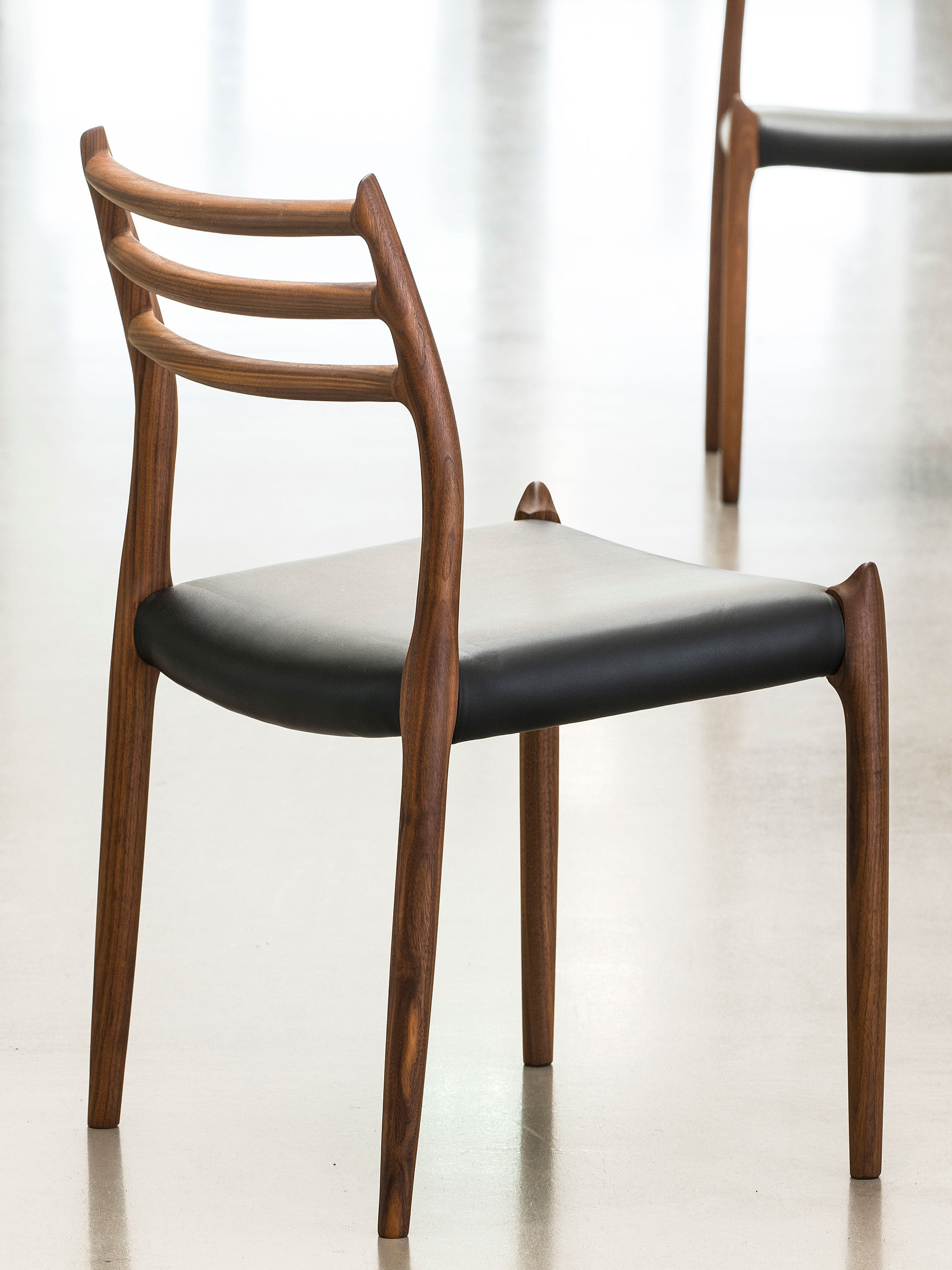 56430 317063121c Moller Chair 78 Walnut Black Leather Full Portrait